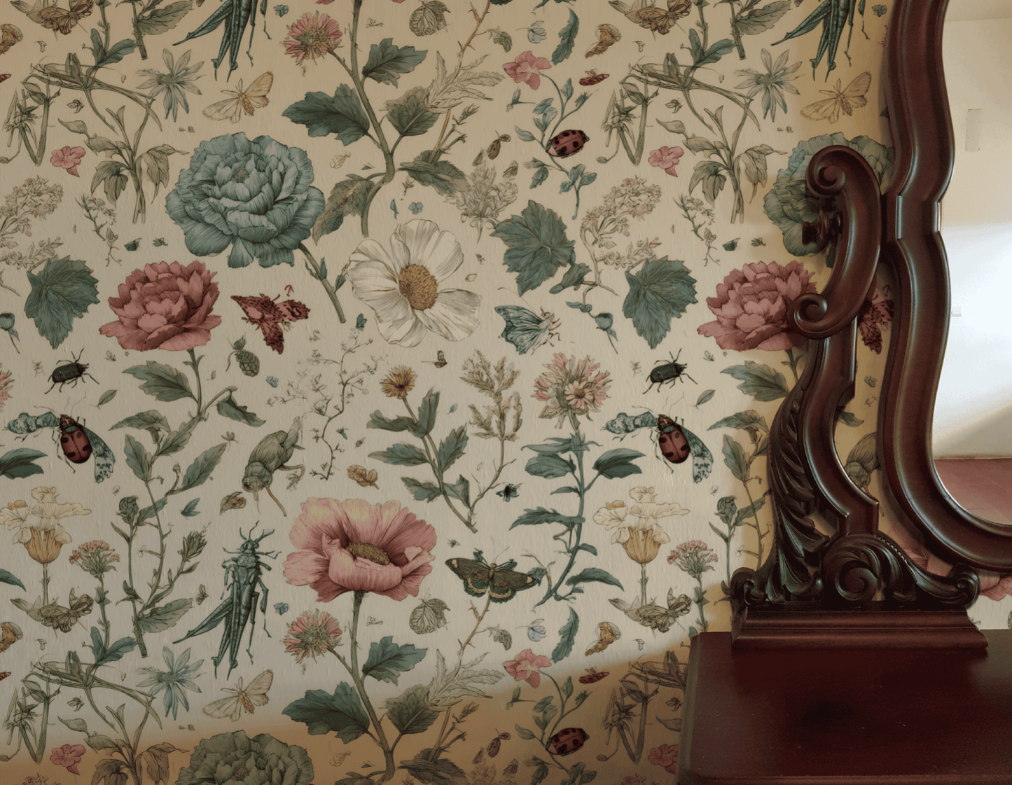 Garden Reverie Wallpaper, featuring flowers, leaves, insects, and butterflies, creates a garden escape beside a dark wood-framed mirror above a wooden shelf.
