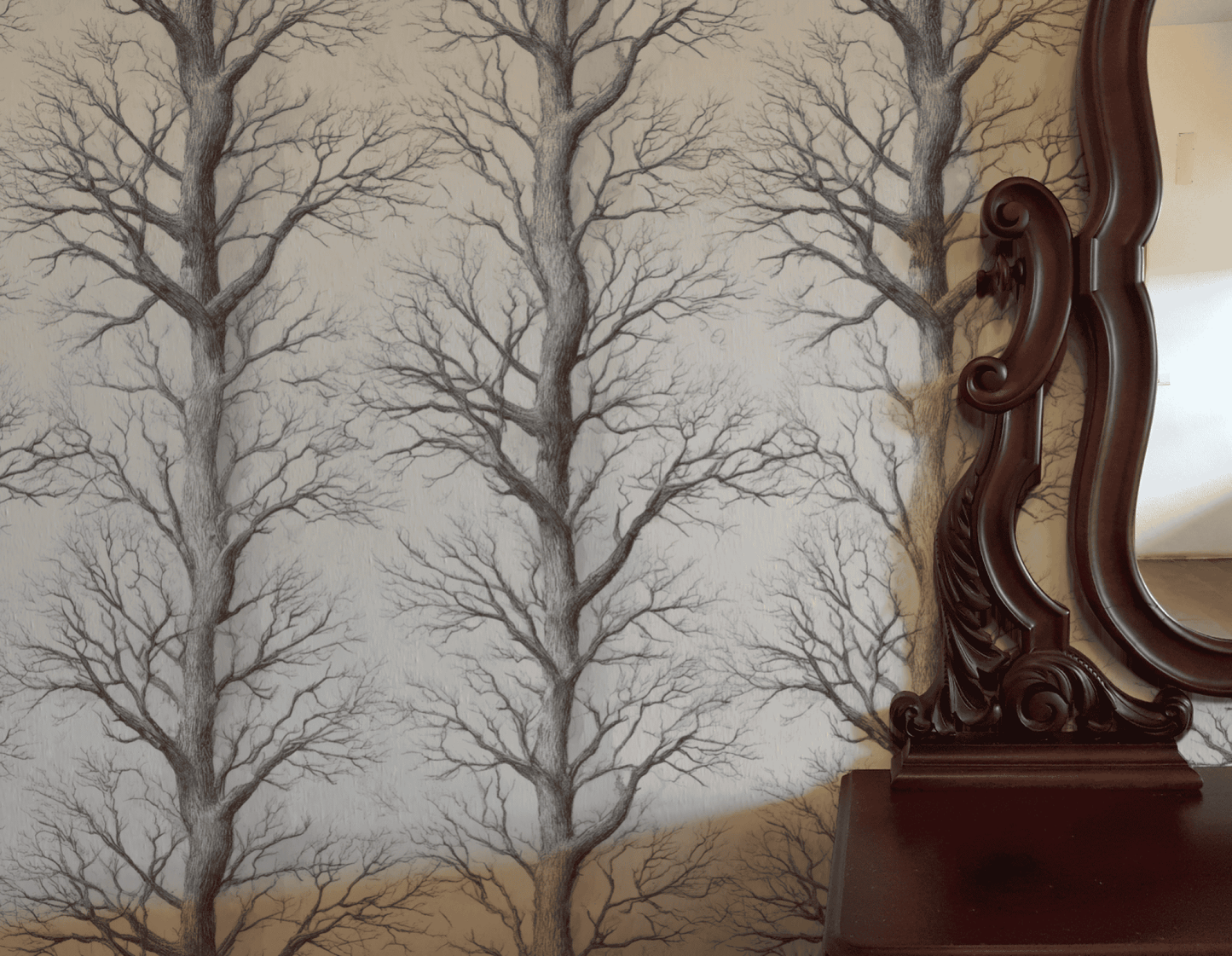 Winter Branches Wallpaper, featuring a repeating black tree branch pattern, adds striking natural decor beside an ornate wooden mirror and a polished wooden surface.