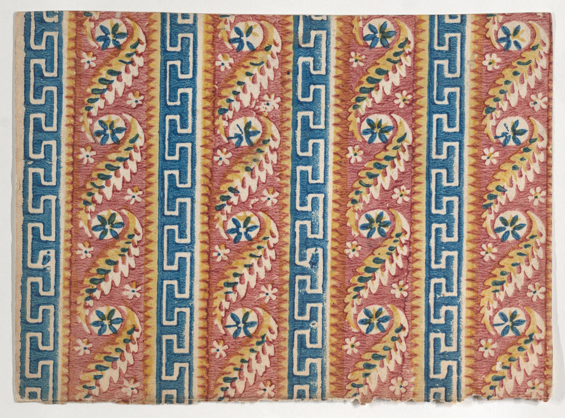 Eighteenth-century relief-printed decorative paper with vertical blue Greek key stripes alternating with paisley and flower stripes on a pink ground