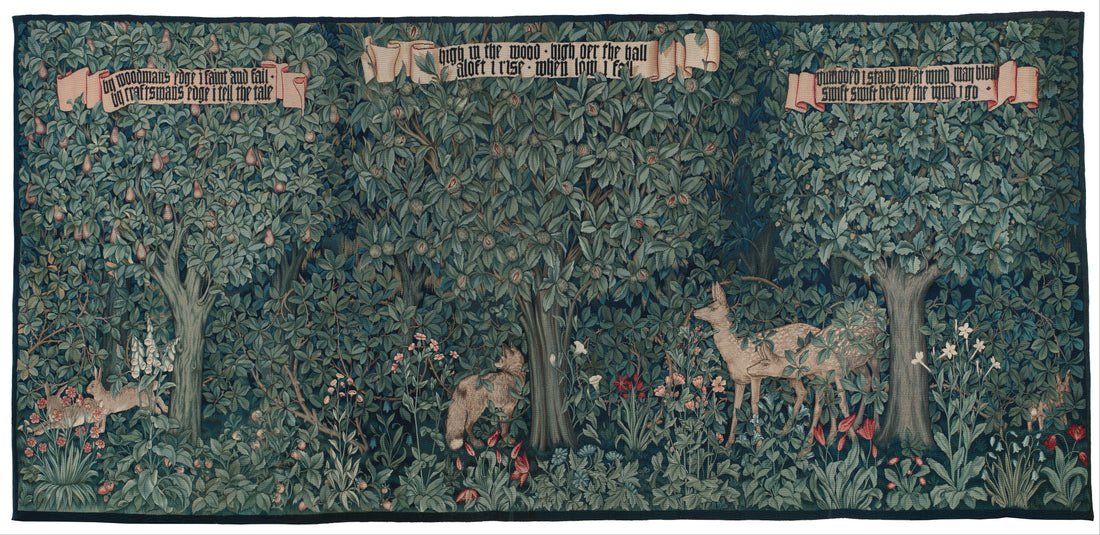 Greenery, a wide woodland tapestry designed by John Henry Dearle in 1892, with tall trees above deer and foxes among flowering plants