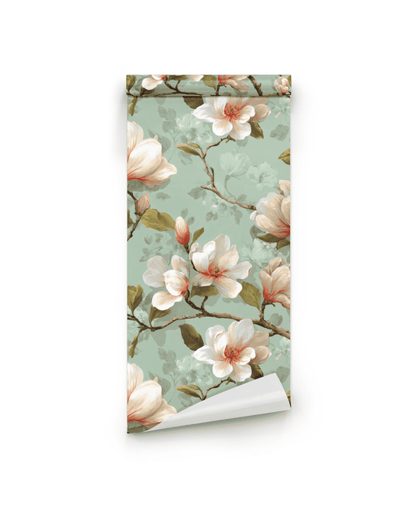Magnolia Dream Wallpaper features a rolled sheet with white and pink magnolia flowers set on an elegant green background.