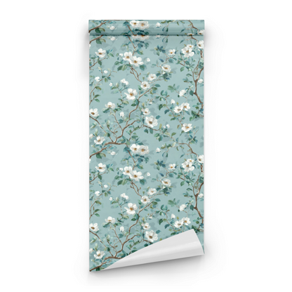 Green Floral Wallpaper roll close-up showing the watercolor blossom detail and the pale celadon ground in soft tonal handling