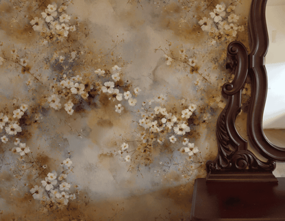 Ethereal Blossom Wallpaper, featuring muted watercolor florals, is paired with an ornate dark wood mirror frame that reflects a light-colored wall, creating a tranquil atmosphere in the space.