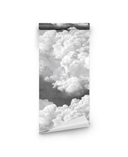 Cloud Drift Wallpaper features a black and white cloud pattern, shown partially unrolled against a white background—ideal for adding tranquil decor and a dreamy ambiance to any space.