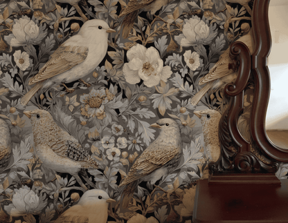 The Serenade Bloom Wallpaper features detailed floral motifs and gentle birds in soft tones, partially reflected in an ornate wooden mirror, adding natural elegance to the space.