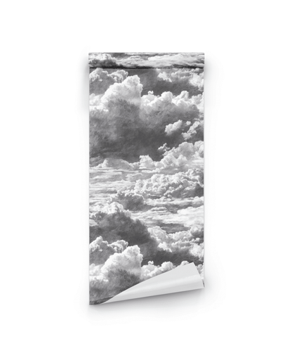 The Nimbus Reverie Wallpaper, shown partially unrolled, reveals its black and white cloud pattern—ideal for adding a serene, dreamlike touch to any room.