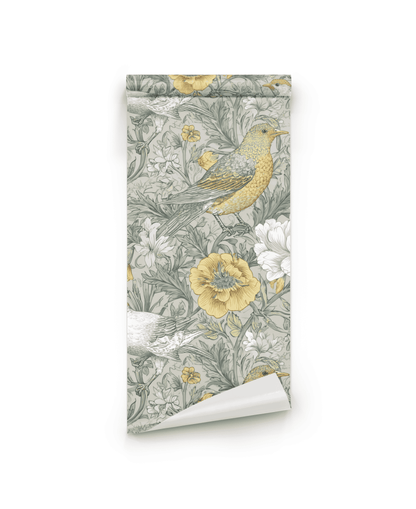 Meadow Whimsy Wallpaper, partially unrolled against a white background, showcases a whimsical floral and bird pattern in muted yellow, grey, and white tones.