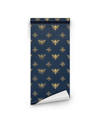 Golden Hive Wallpaper, a luxury roll with a repeating gold bee pattern on a rich navy background, is shown partially unrolled on a white surface.