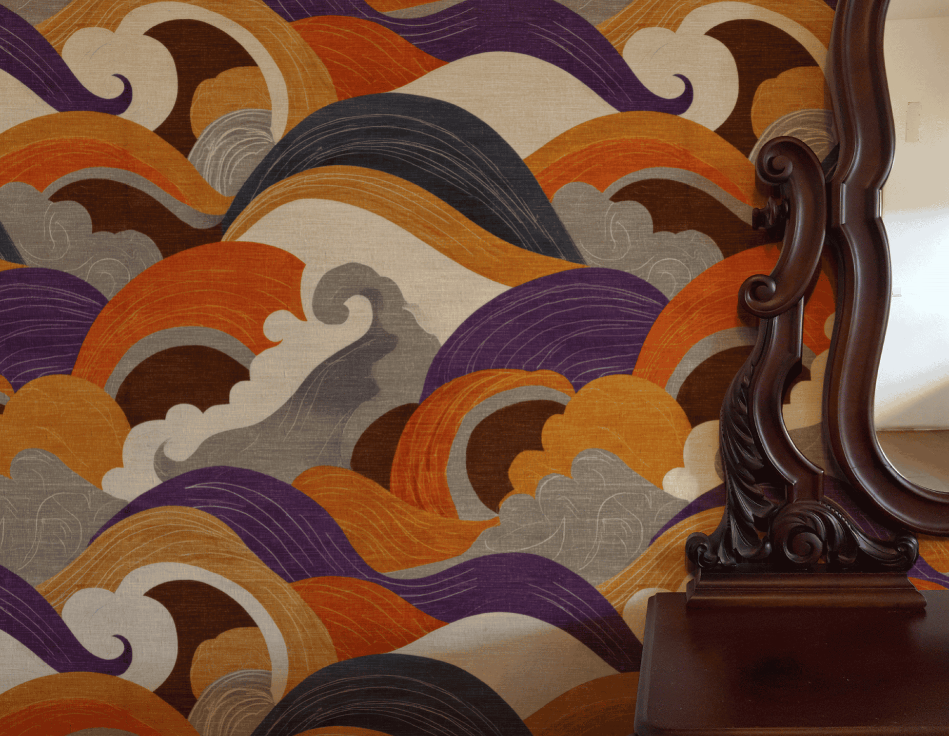 A decorative wooden mirror stands beside a vibrant Eclipse Waves Wallpaper, featuring bold curves and wavy designs in orange, brown, purple, and gray that fill the space with rich tones and dynamic energy.