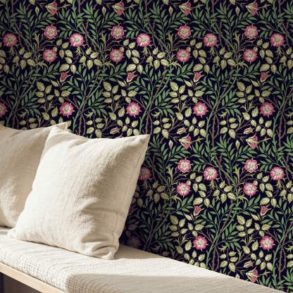 Green Floral Wallpaper installed in a room interior with the Morris sweet briar rose design in moody dark botanical Victorian palette