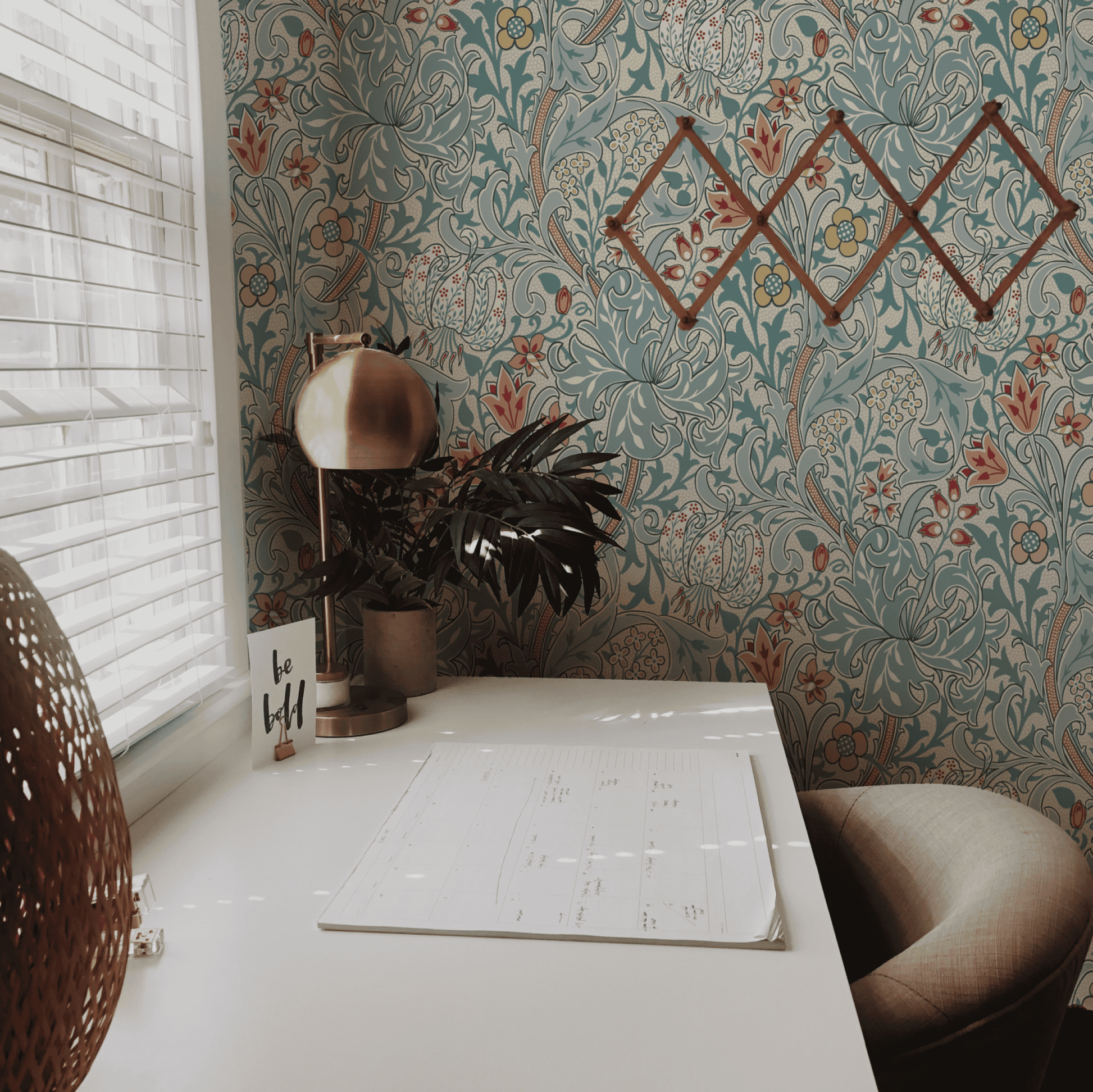 Green Floral Wallpaper installed in a room interior with the John Henry Dearle lily design for Morris and Co in heritage green
