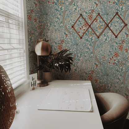 Green Floral Wallpaper installed in a room interior with the John Henry Dearle lily design for Morris and Co in heritage green