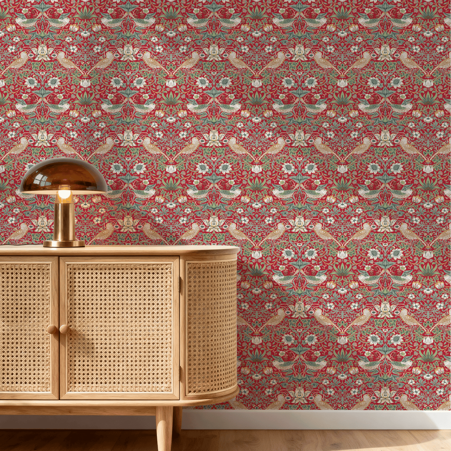 Red Bird Pattern Wallpaper installed on a room wall with the iconic 1883 Morris thrushes-among-strawberries design in deep heritage red