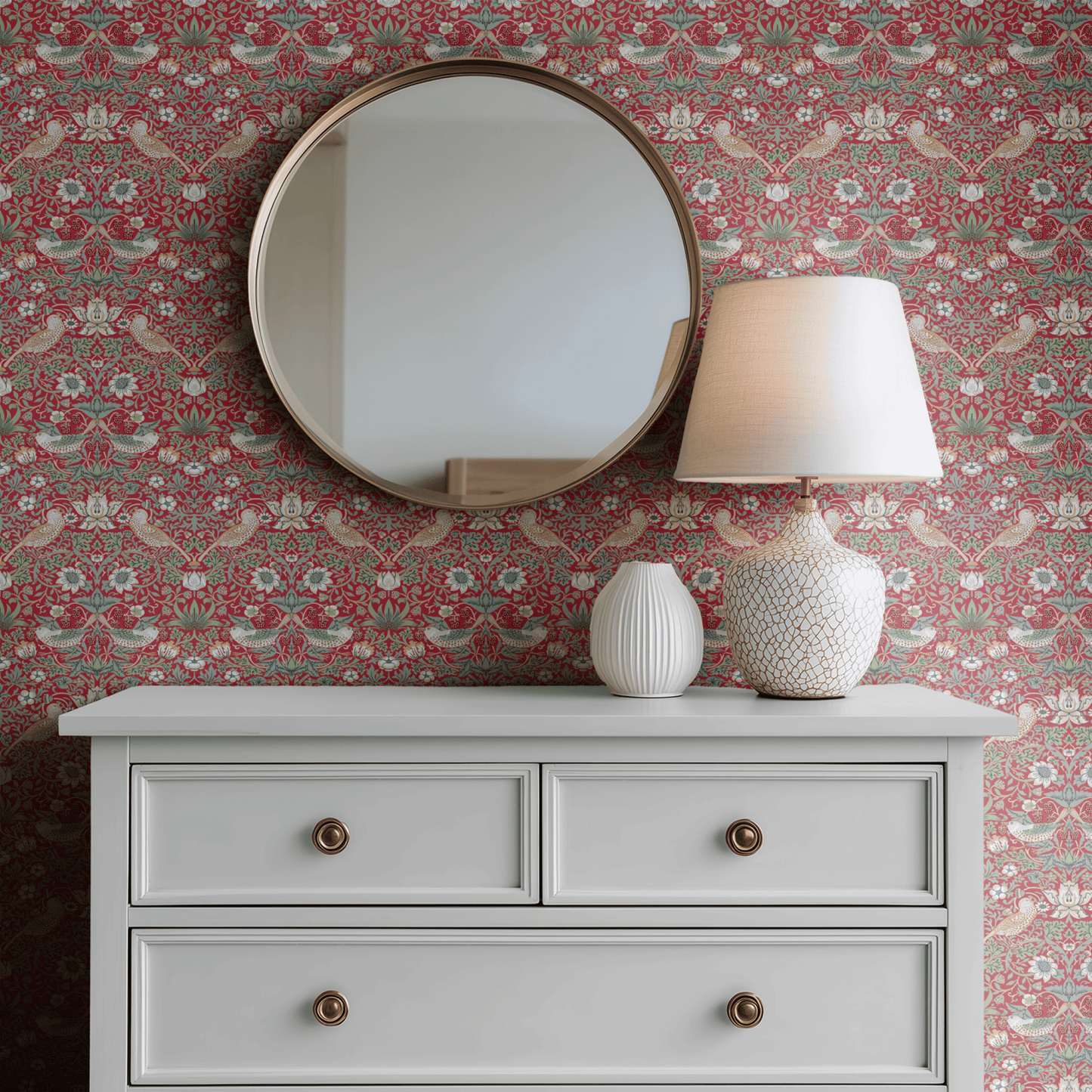 Red Bird Pattern Wallpaper shown in a second interior with the heritage red Strawberry Thief reading as the iconic Morris decoration in its original palette