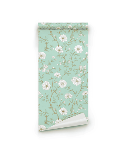 Whispering Blooms Wallpaper features a mint green background with white floral branches and leaves, making it an elegant decor choice for any room.