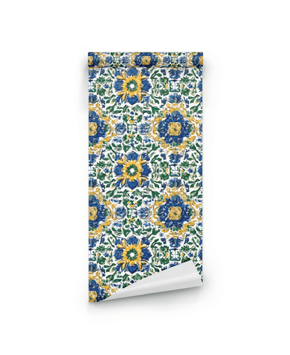 Mediterranean Bloom Wallpaper: A roll of vibrant wallpaper featuring symmetrical blue, yellow, and green floral motifs on a white background.