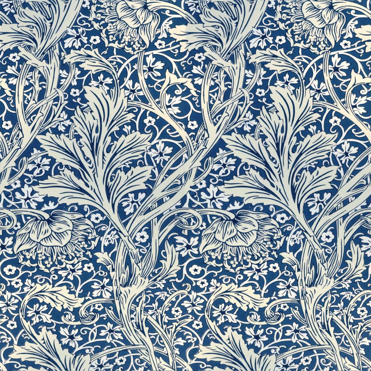 Cream scrolling stems and feathery leaves over a deep blue ground with tiny white blossoms, a William Morris design.