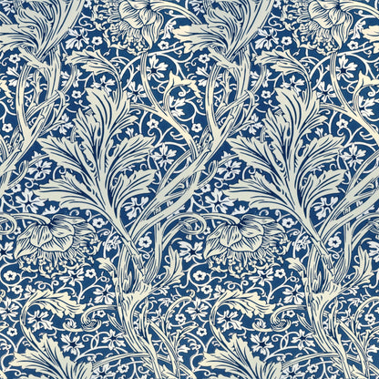 Cream scrolling stems and feathery leaves over a deep blue ground with tiny white blossoms, a William Morris design.