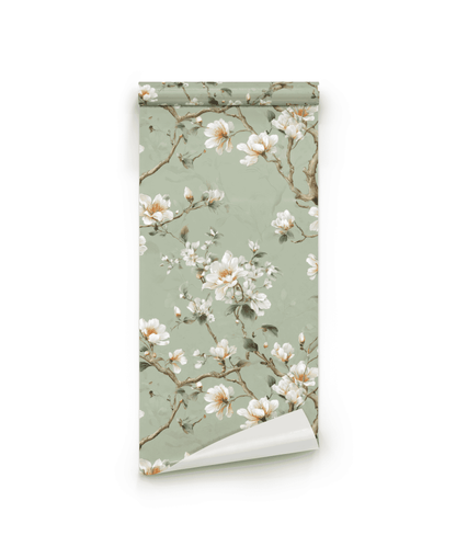 Magnolia Whispers Wallpaper features magnolia blossoms and brown branches on a sage backdrop, creating a tranquil atmosphere with its muted green tones.