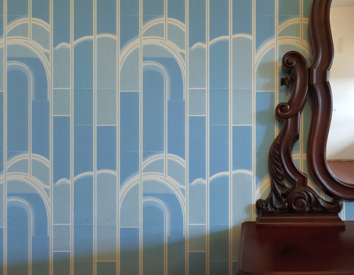 Blue Arches large scale wallpaper in a styled room