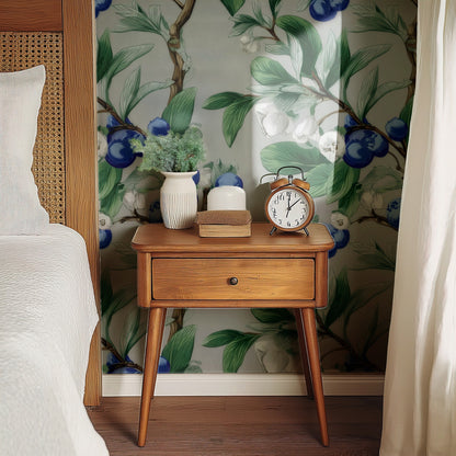 Blueberry Branch large scale wallpaper behind a wooden bedside table