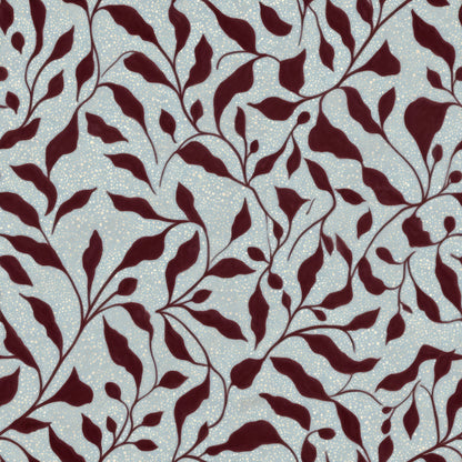 Burgundy painted leaves trailing on vines over a speckled pale blue ground.