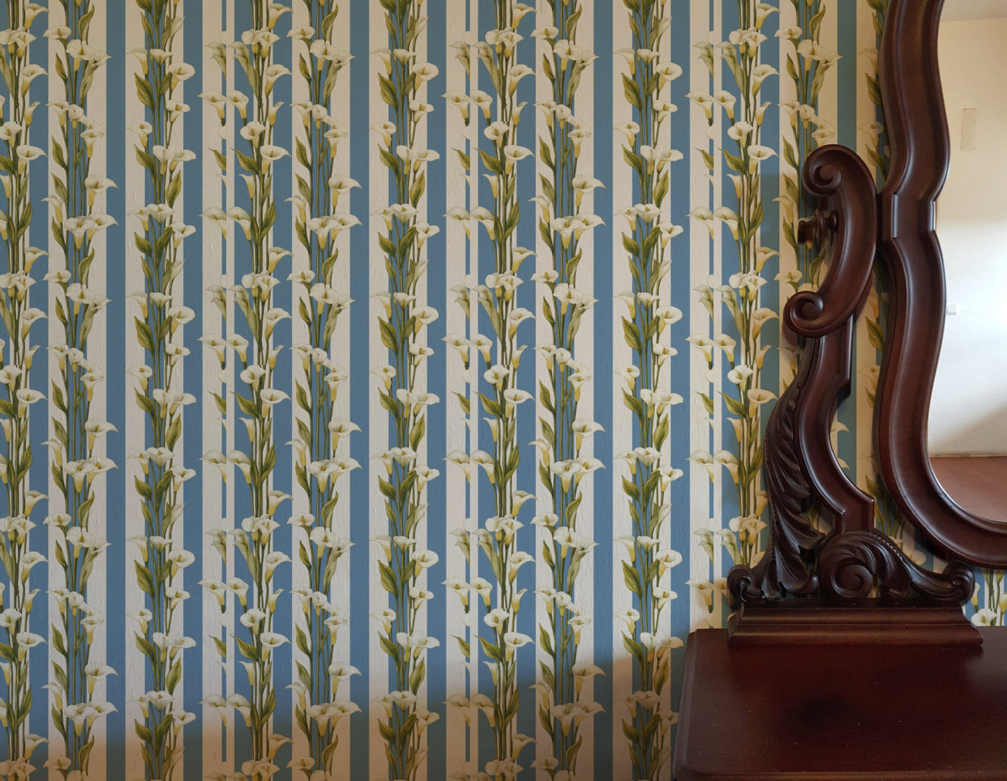 White calla lilies climbing a blue-and-white vertical cabana stripe in a fresh classic wallpaper. - room view