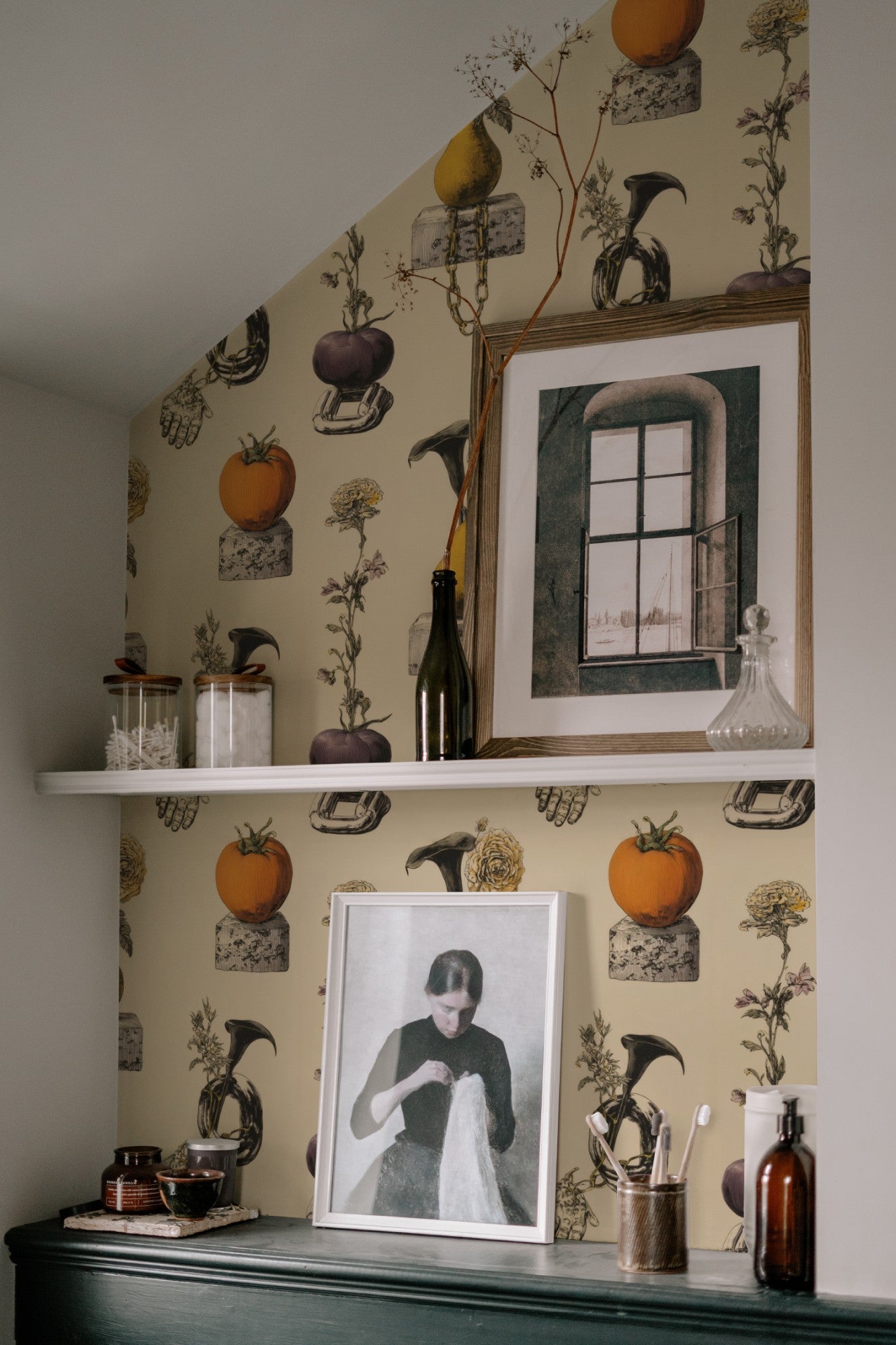 Surreal still-life wallpaper of pears and tomatoes on cinderblocks with chains, a hand and calla lilies on cream. - room view