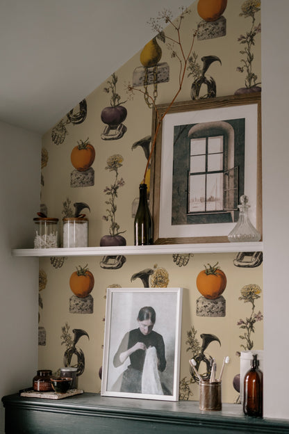Surreal still-life wallpaper of pears and tomatoes on cinderblocks with chains, a hand and calla lilies on cream. - room view