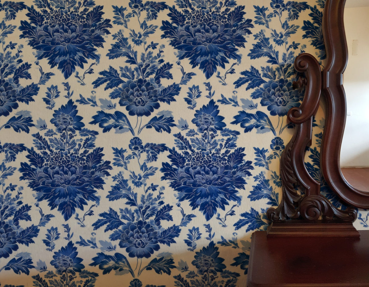 Delft Bouquet large scale wallpaper in a styled room