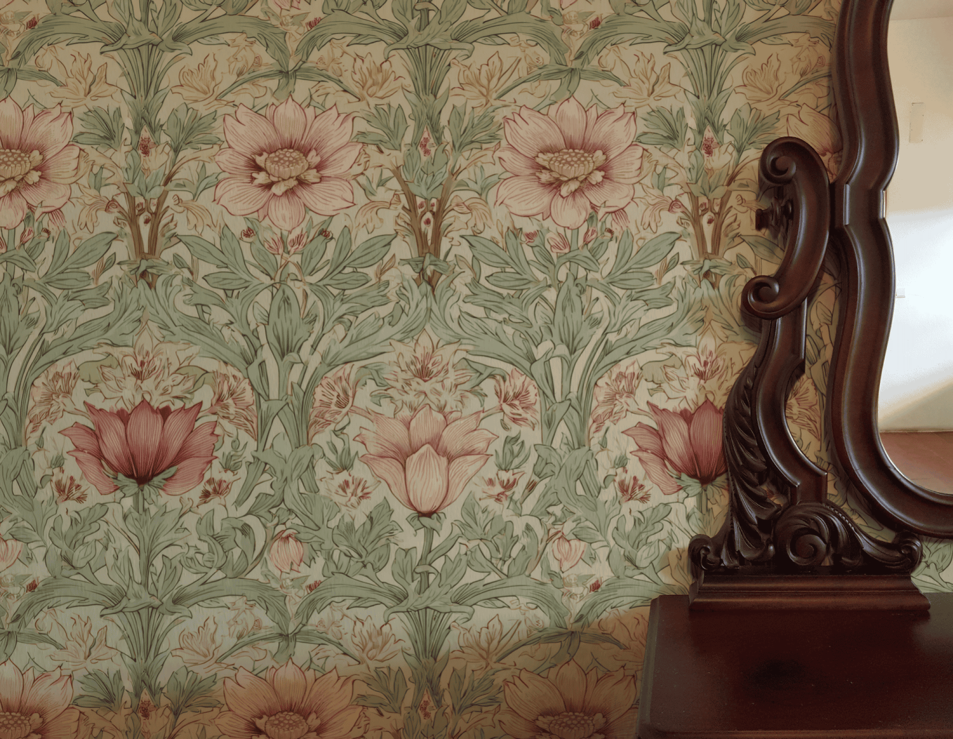 The Eden Blossom Wallpaper, featuring pink petals and green leaves in a floral pattern, is placed next to a dark wooden mirror with ornate carved details.