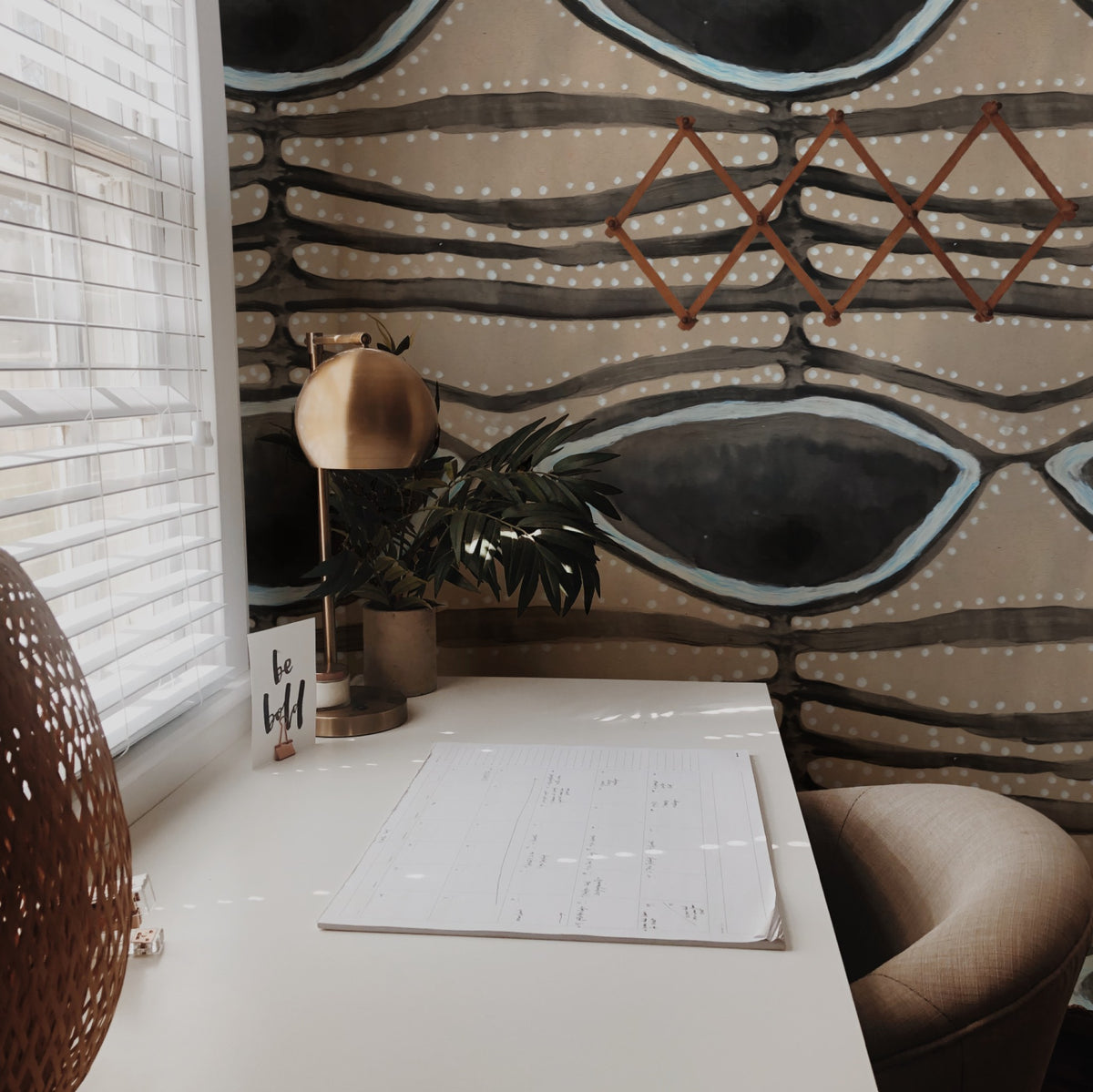 Earthen Current wallpaper on a wall in a styled room