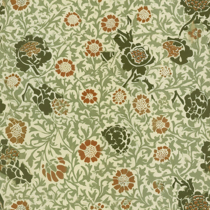 Rust and deep green blooms over fine sage leaves on a cream ground, a William Morris design.