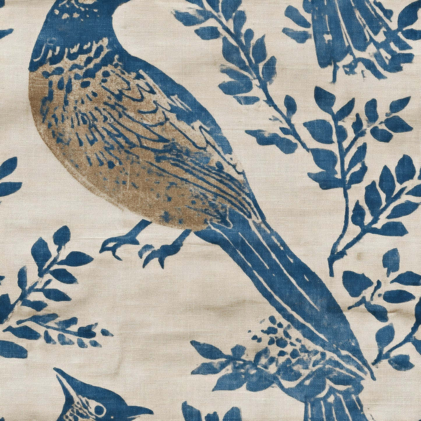 Block printed bird in indigo blue and gold perched on branches over flax linen.