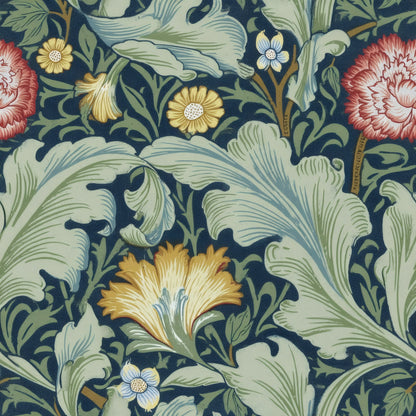 Pale-green acanthus leaves, red carnations and gold flowers on a deep navy ground, a William Morris design.