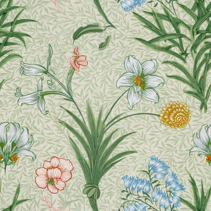 White lilies, blue flowers and pink roses rise from tall leaves over a soft sage ground, a William Morris design.