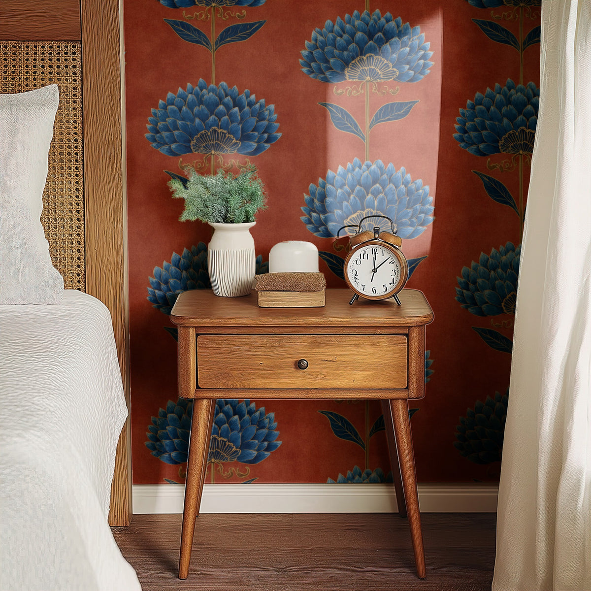Terracotta Bloom wallpaper on a wall behind a bedside table with a clock