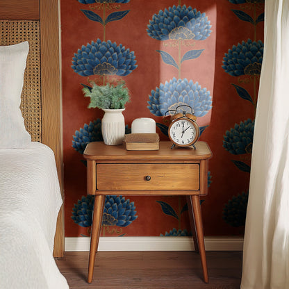 Terracotta Bloom wallpaper on a wall behind a bedside table with a clock