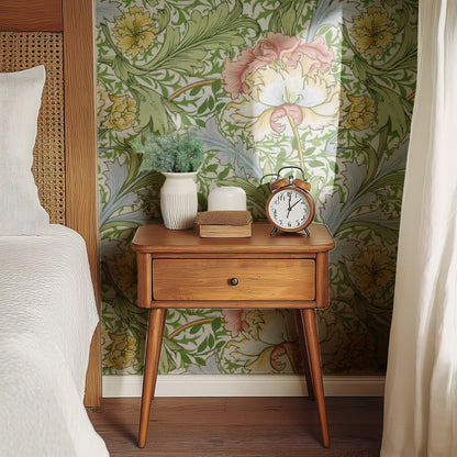 William Morris Myrtle Green wallpaper on a wall — Bedside table with clock scene