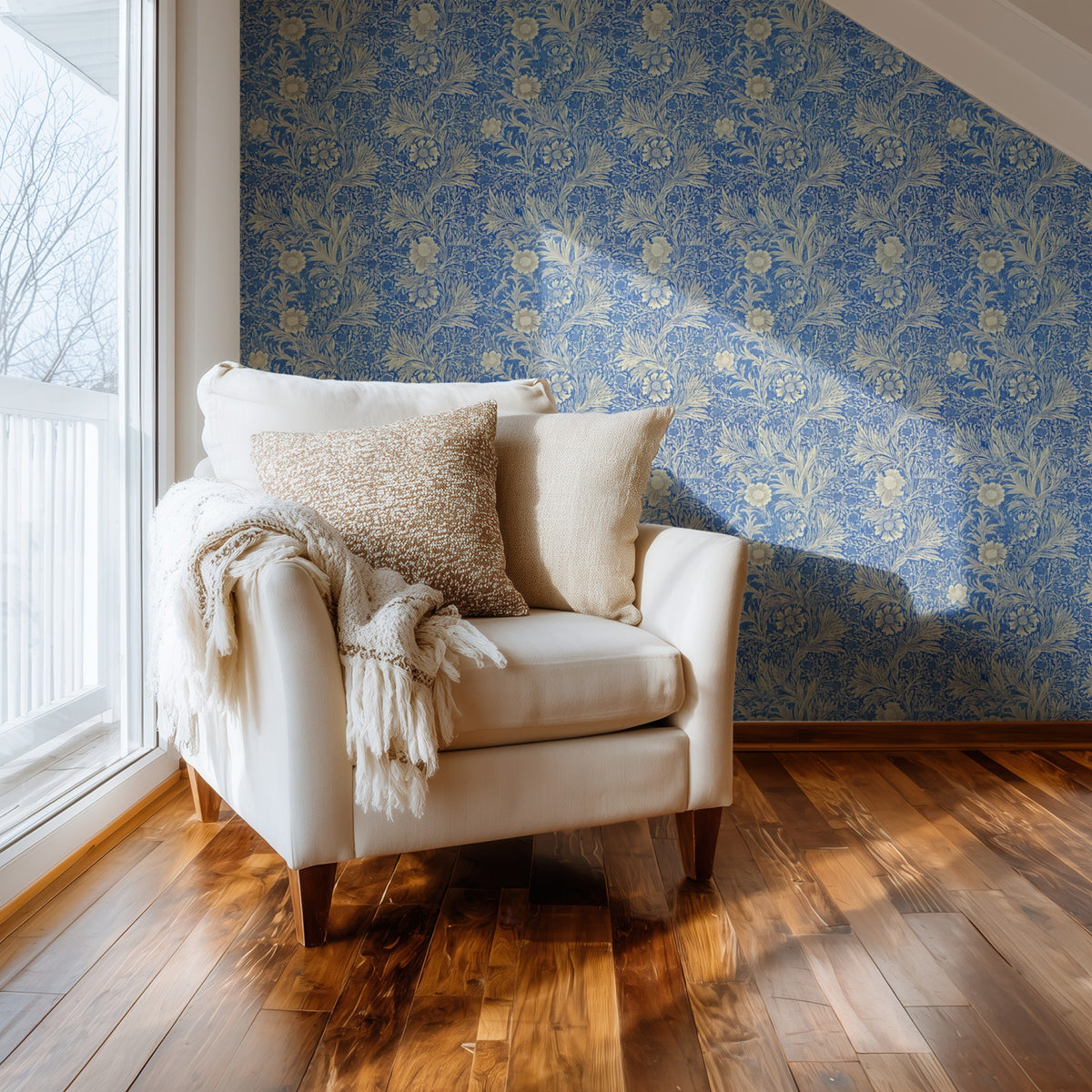 William Morris Marigold Blue wallpaper on a wall — Comfy chair by window scene