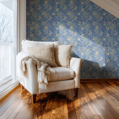 William Morris Marigold Blue wallpaper on a wall — Comfy chair by window scene