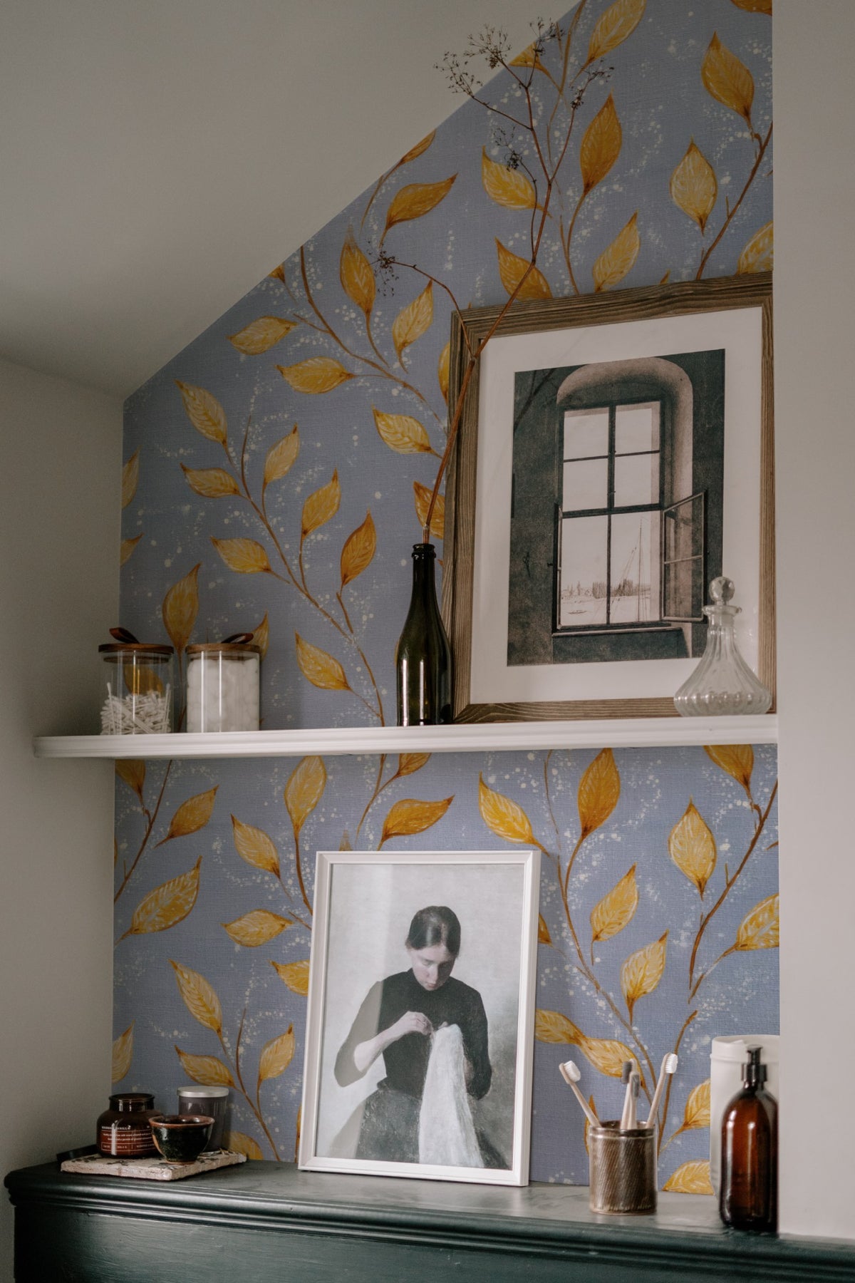 Golden Sprig wallpaper on a wall in a styled room