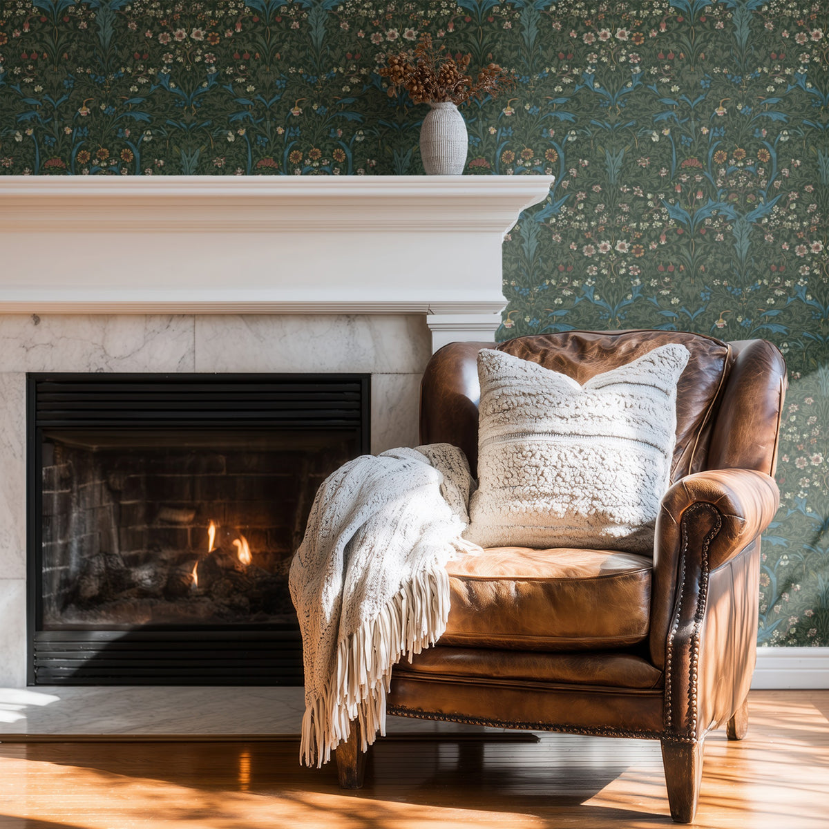 William Morris Blackthorn Green wallpaper on a wall — Wingback chair by fire scene