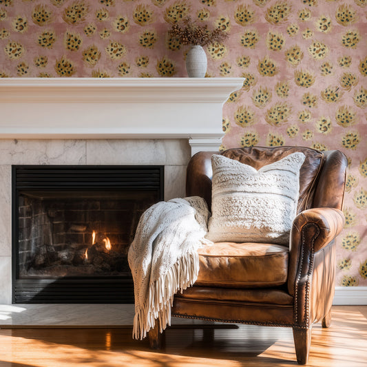 Blush Leopard wallpaper shown on a wall — Wingback chair by fire scene