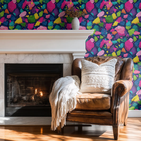 Jewel Terrazzo wallpaper shown on a wall — Wingback chair by fire scene