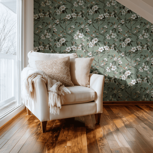 Sage Dogwood wallpaper with Arts and Crafts botanical dogwood florals in soft sage green, shown installed on a living-room wall at room scale