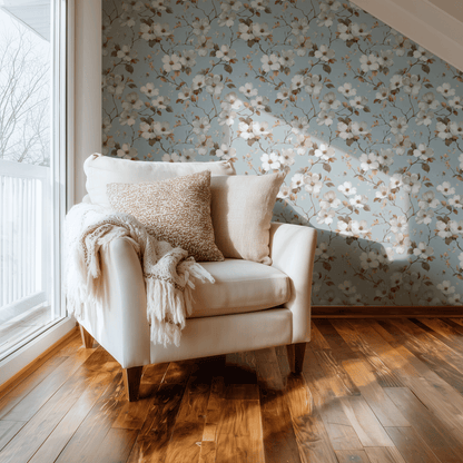 Creamy Dogwood wallpaper with dogwood florals in cream and gentle blue accents, shown installed in a second interior for room context