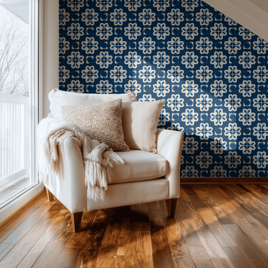 Cerulean Fleur wallpaper with block-print fleur-de-lis geometric pattern in cerulean blue, shown installed on a living-room wall at room scale