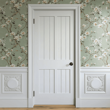 Green Floral Wallpaper shown in a second interior with the magnolia florals giving the wall a calm botanical character