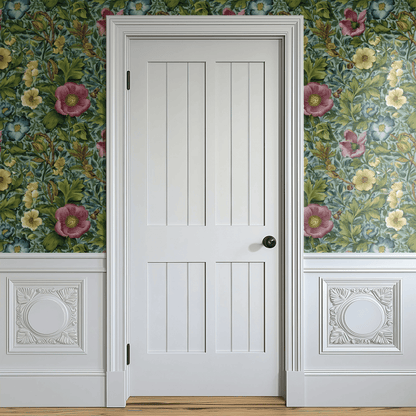 Green Floral Wallpaper shown in a second room with the verdant rosaline reading as warmly traditional Arts and Crafts decoration